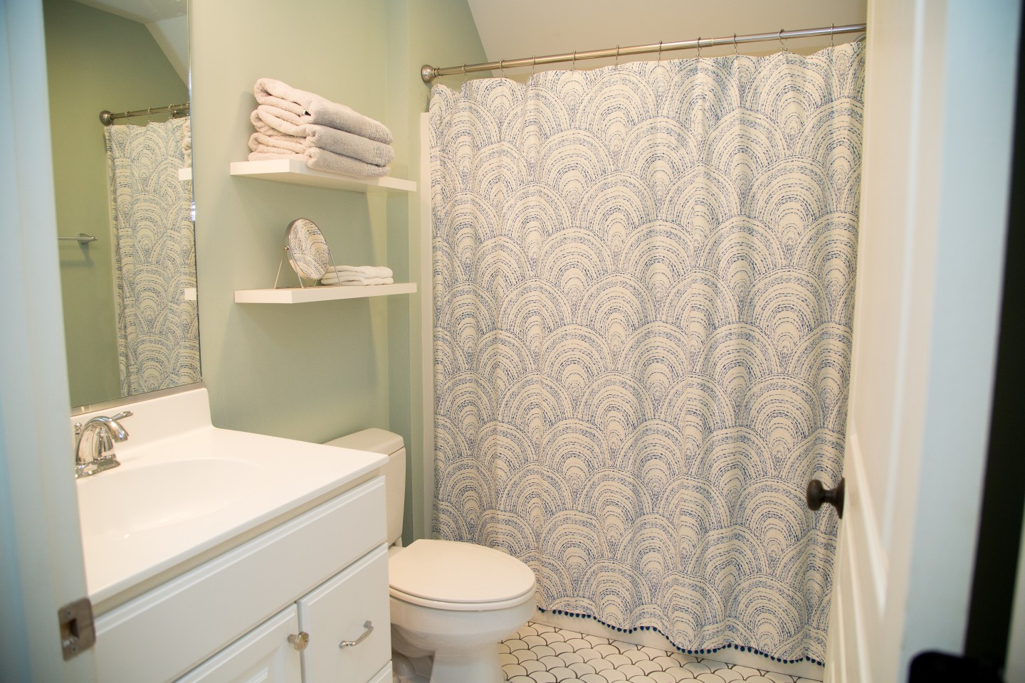 Bathroom with White Vanities, White Tiles and Shower Curtain
