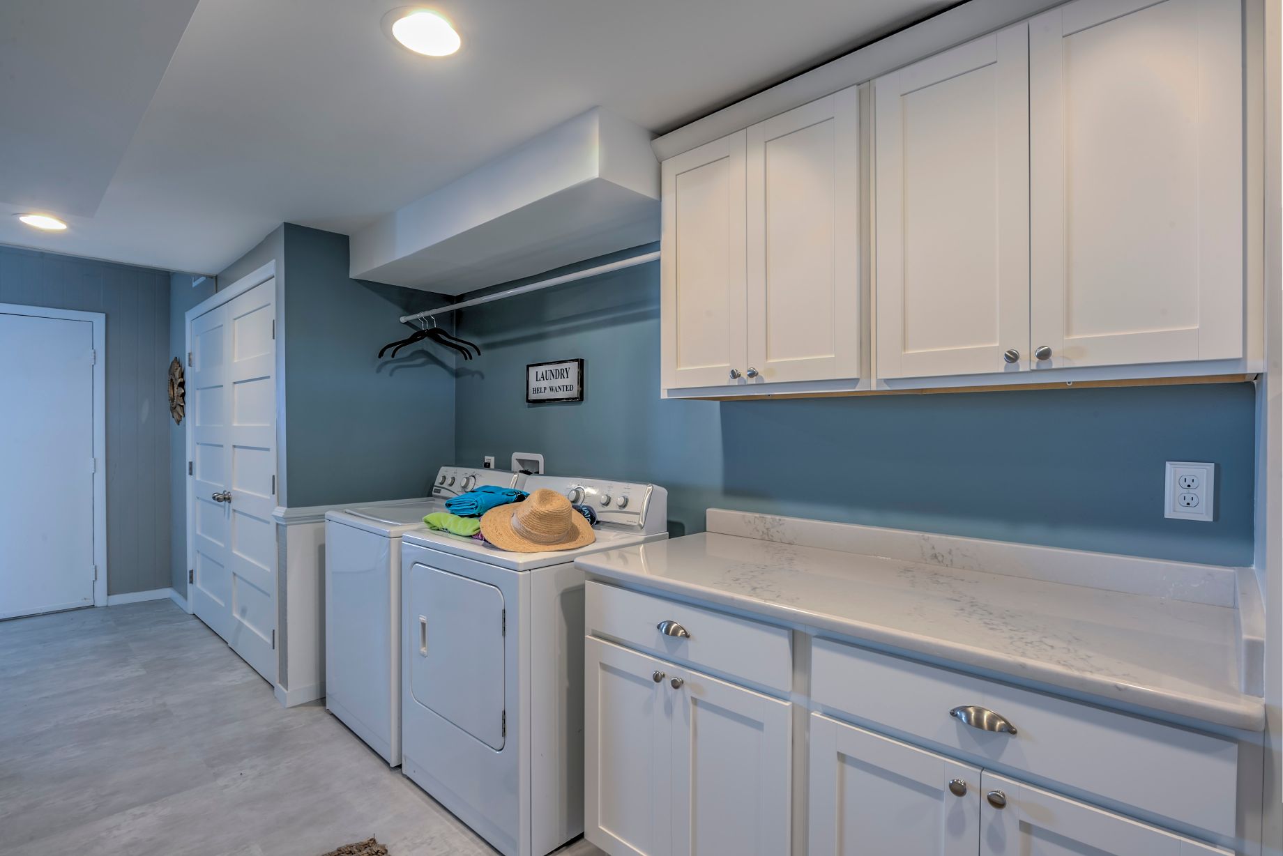 Renovation in Campbell Place, Bethany Beach DE with White Cabinets and Monterey Granite Countertop