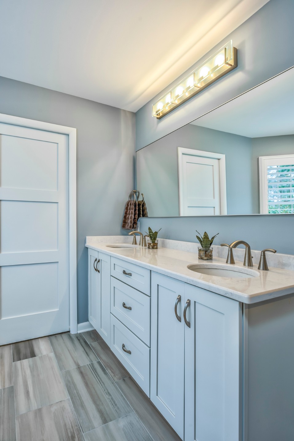 Canal Way Bathroom Remodel in Bethany Beach DE with White Shaker Cabinets and Two Sinks