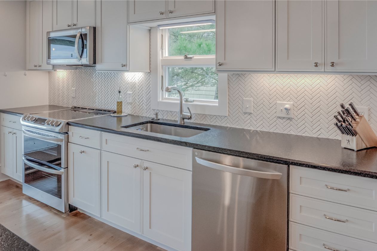 Kitchen with White Vanities and White Tiles Backsplash