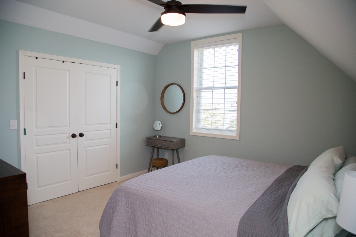 Guest Bedroom with White Closet and Ceiling Fan