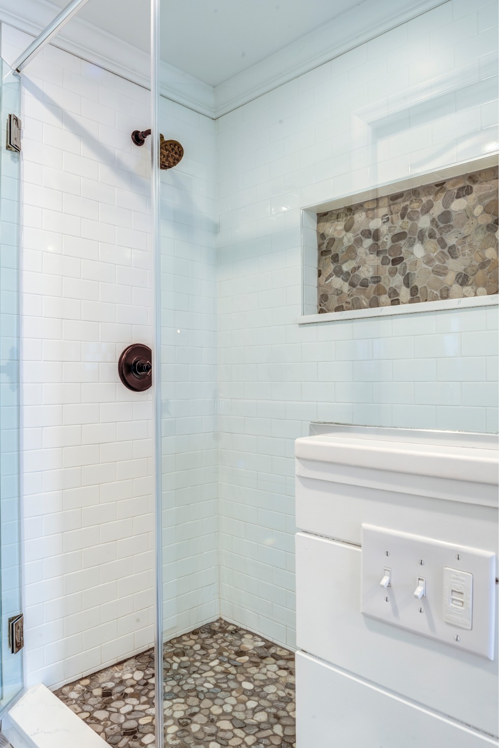 Hatteras Drive Master Suite in Bethany Beach DE - Master Bathroom - Shower with White Wall Tiles and Stone Mosaic Floor