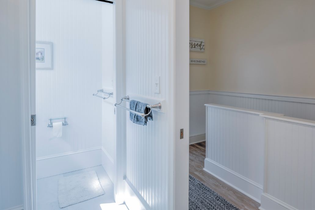 Bathroom with White Walls and Sliding Door