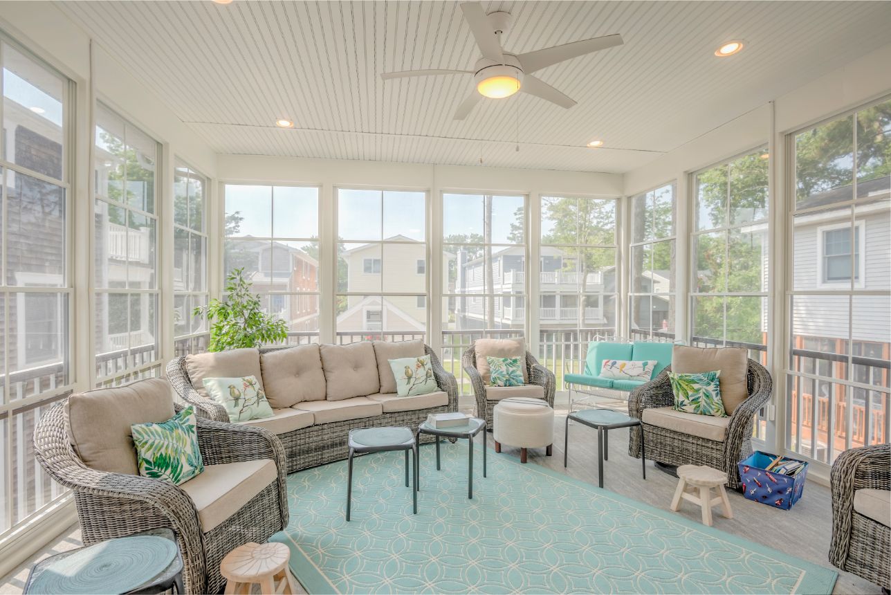 Addition in Hollywood Street, Bethany Beach DE - Sunroom with Rattan Furniture and Teal Accents