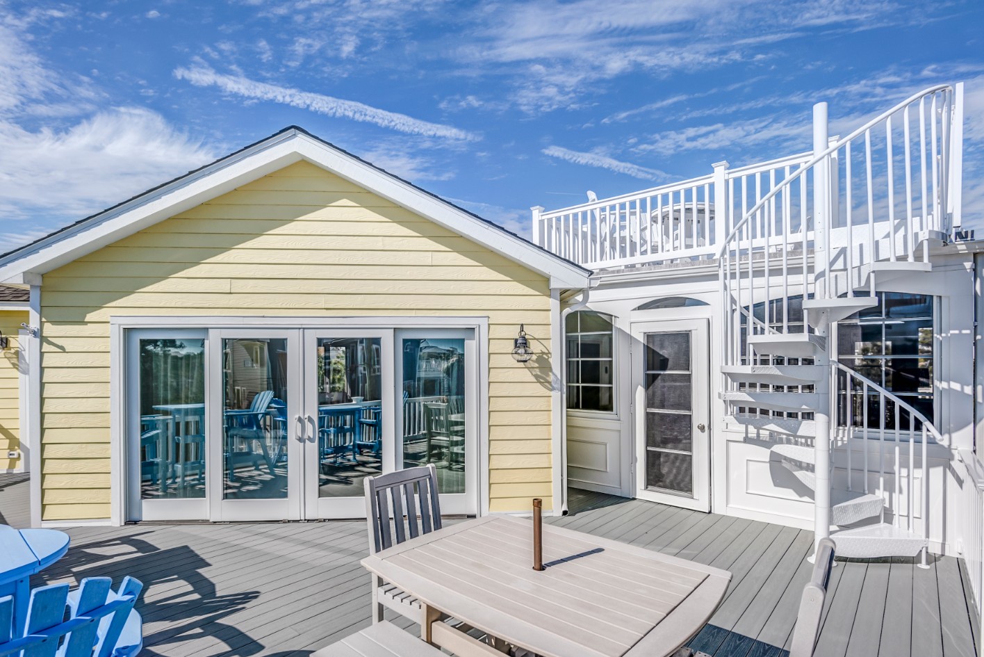 Indian Street Exterior in Bethany Beach DE - Second Level Deck with Table, Chairs and Spiral Staircase
