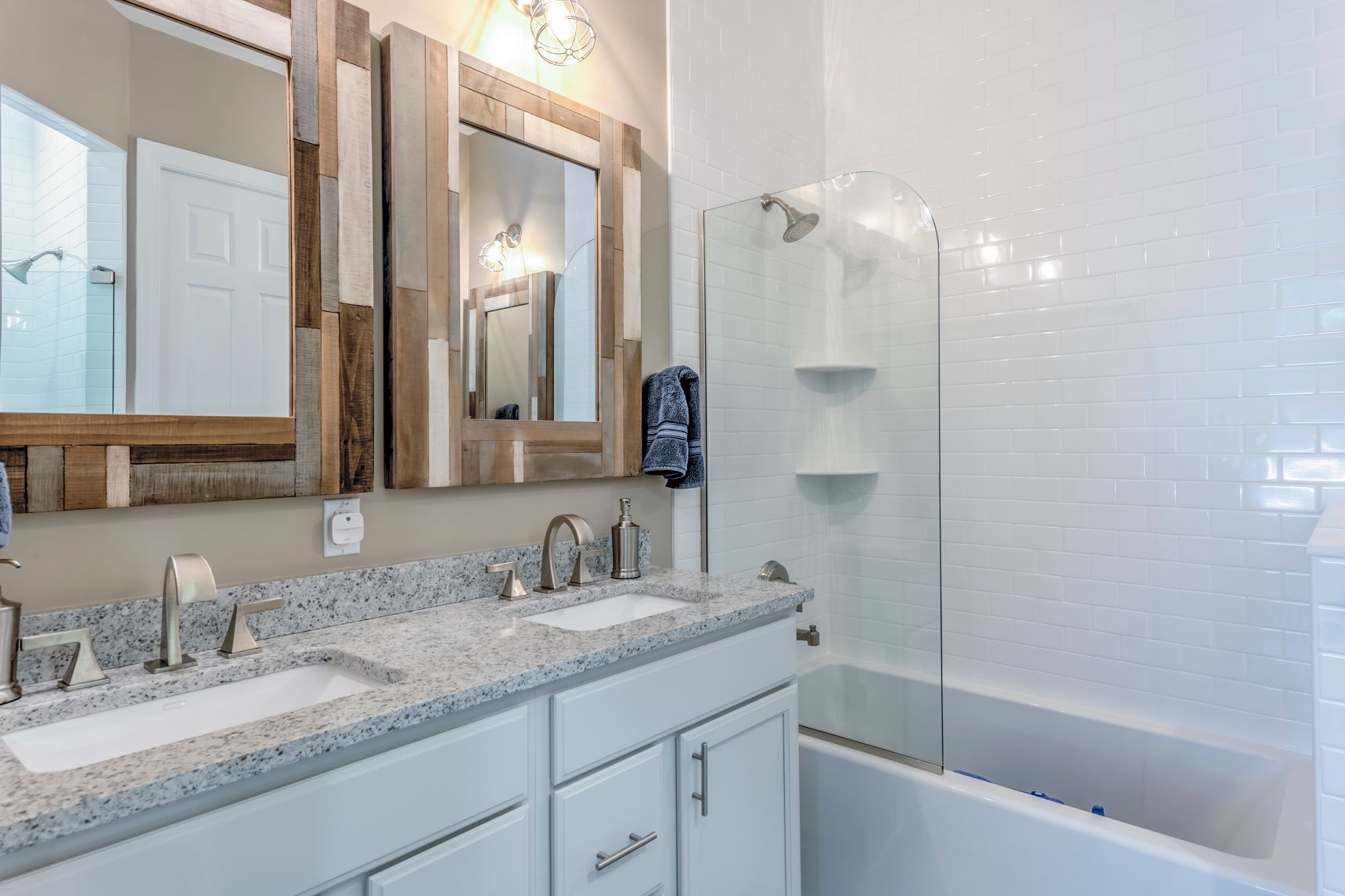 Addition in Juniper Court, Ocean Pines MD - Bathroom with Dual Sink and Two Square Mirrors with Mosaic Frames