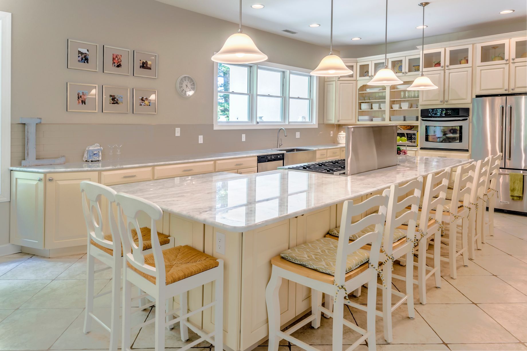 Addition in Juniper Court, Ocean Pines MD - Kitchen with Four Pendant Lights and White Chairs