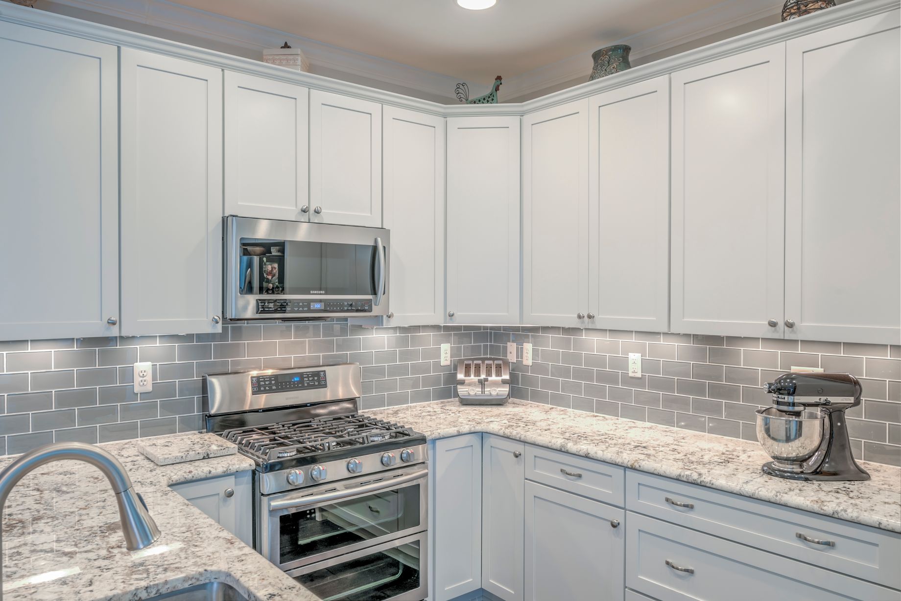 Kitchen Remodel in Shelter Drive, Selbyville DE with White Cabinets and Gray Subway Glass Backsplash Tiles