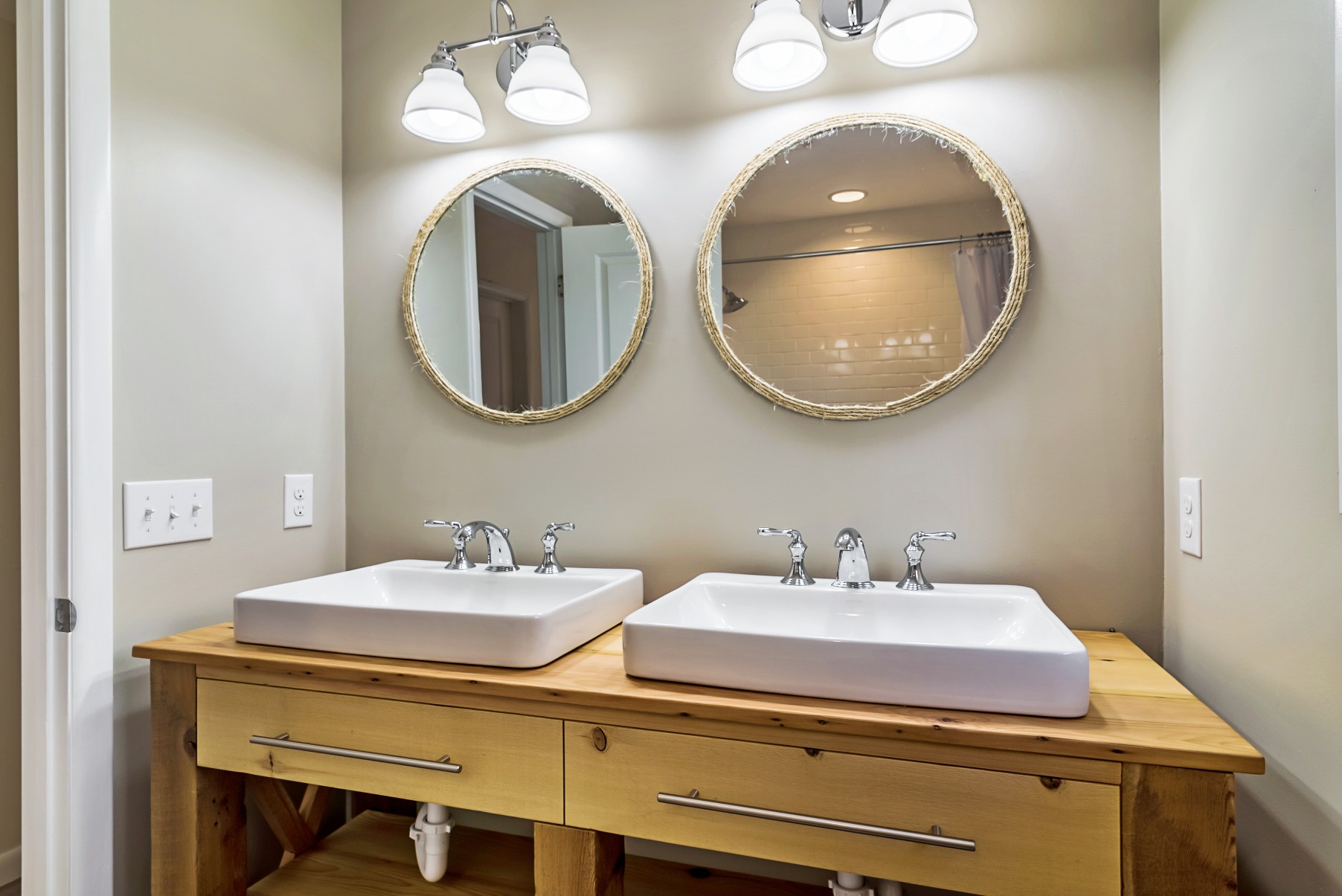 Bathroom with Two Large Round Mirrors in Wellington Parkway, Bethany Beach DE Renovation
