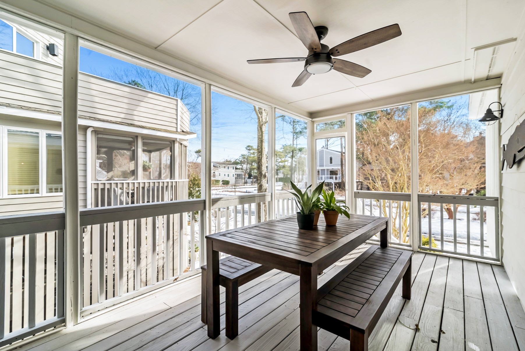 Four Season Porch with Wooden Table, Bench Seats and Ceiling Fan in Wellington Parkway, Bethany Beach DE Renovation