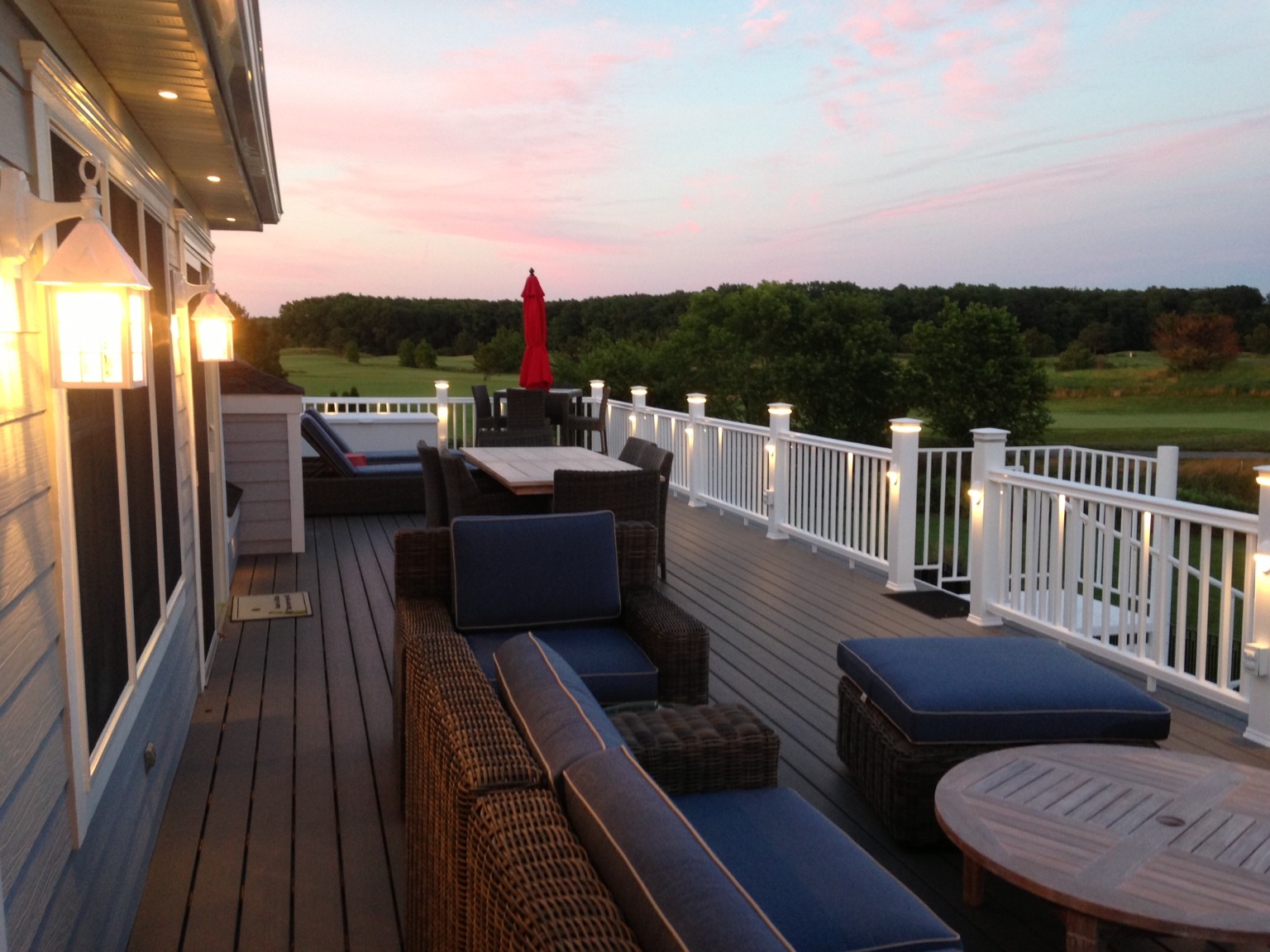 Willow Oak Deck Addition in Bear Trap Dunes, Ocean View DE with White Vinyl Railing with Lights and Round Table