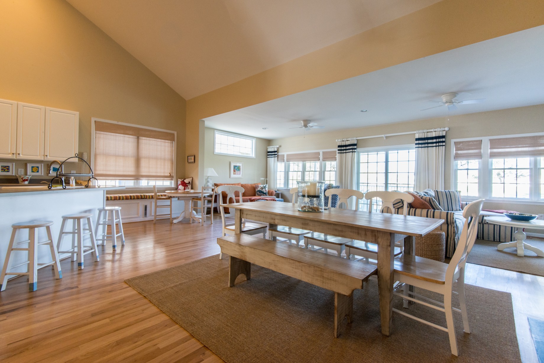 Willow Oak New Addition in Bear Trap Dunes, Ocean View DE Extended Family Room Dining Room Area with Wood Table and Hardwood Flooring